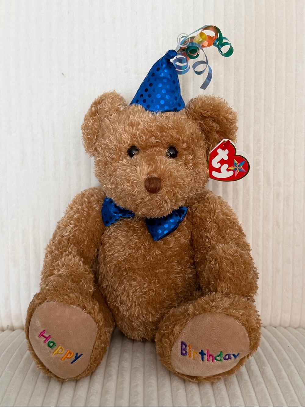 Kids plush toy with birthday hat